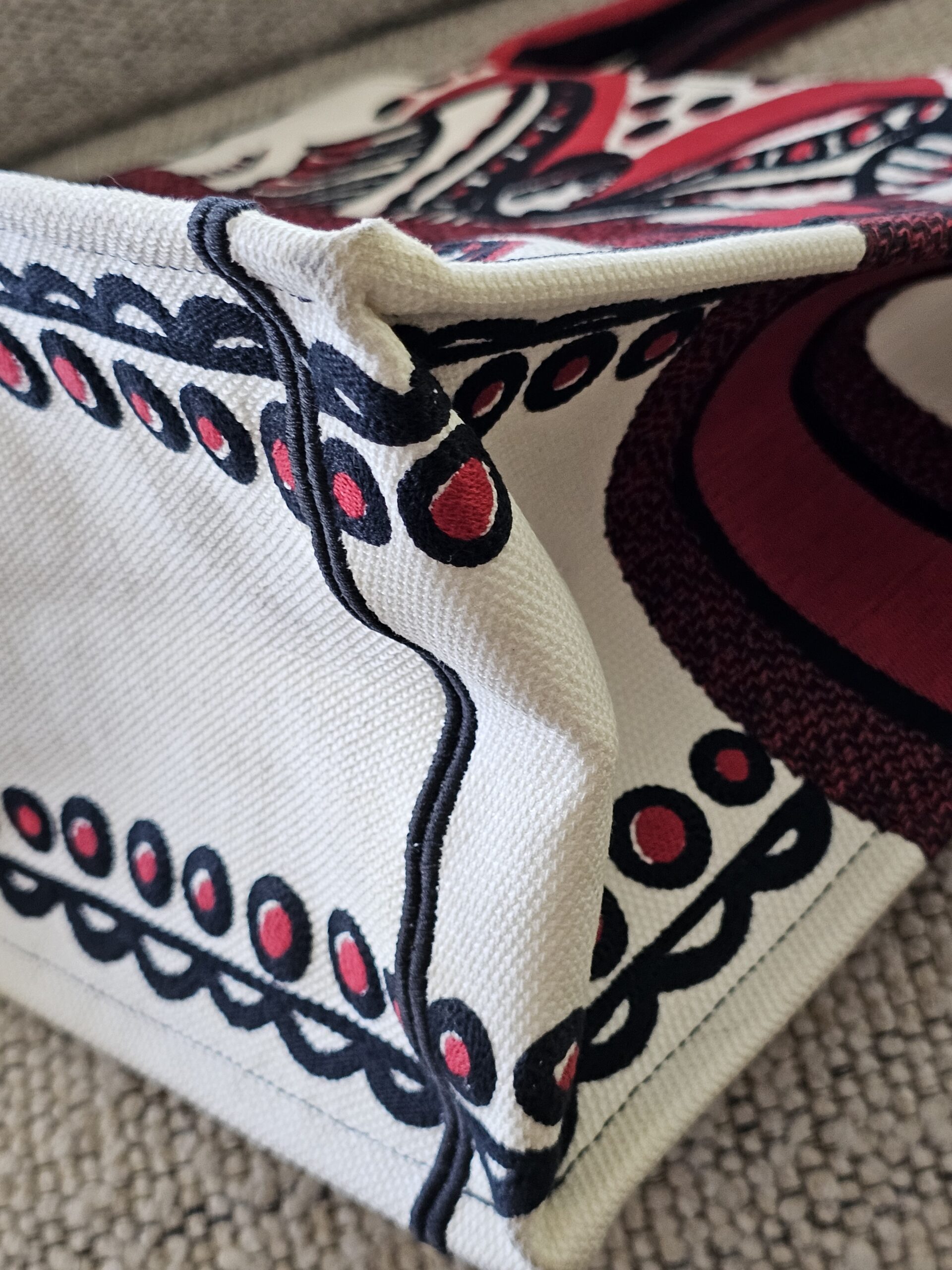 Lower corner of the Christian Dior Dioramour Book Tote with edge wear