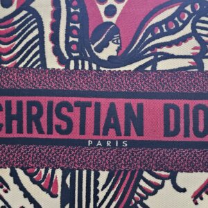 Close-up of the CHRISTIAN DIOR PARIS embroidered band across the Dioramour Book Tote