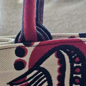Base of an embroidered handle on the Dioramour Book Tote