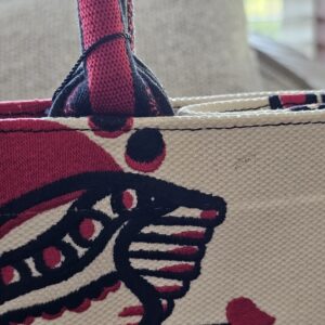 Heart and arrow detail in the D-Chess Heart embroidery near the handle