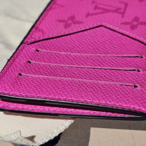Card slots on the reverse of the fuchsia coin card holder