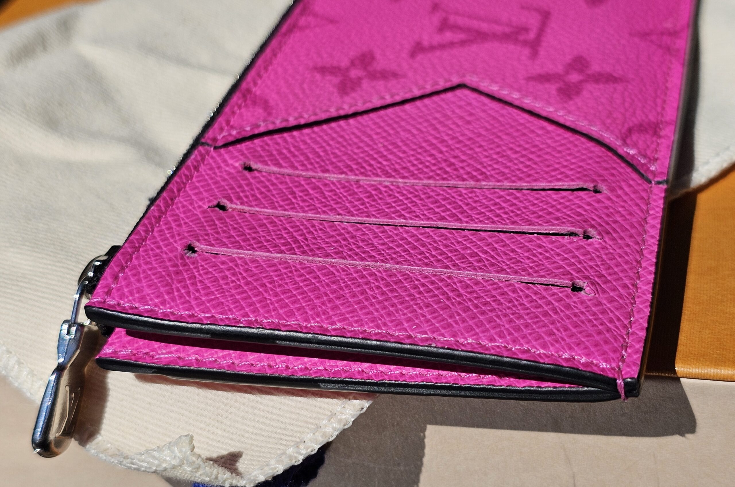 Card slots on the reverse of the fuchsia coin card holder