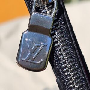 Silver-tone LV zip pull on the fuchsia coin card holder