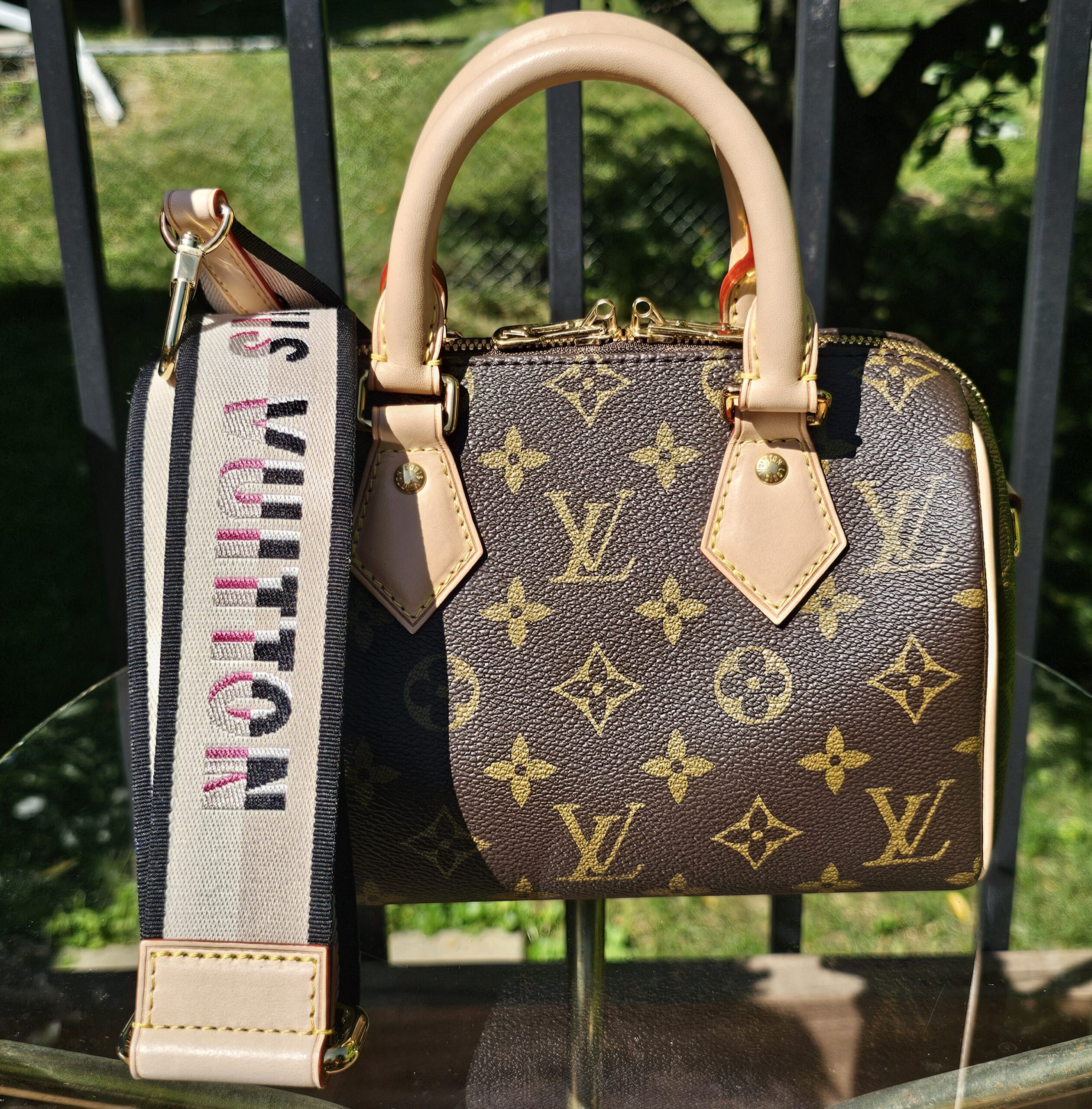 Louis Vuitton Monogram Speedy Bandoulière 20 - front view with the printed shoulder strap attached