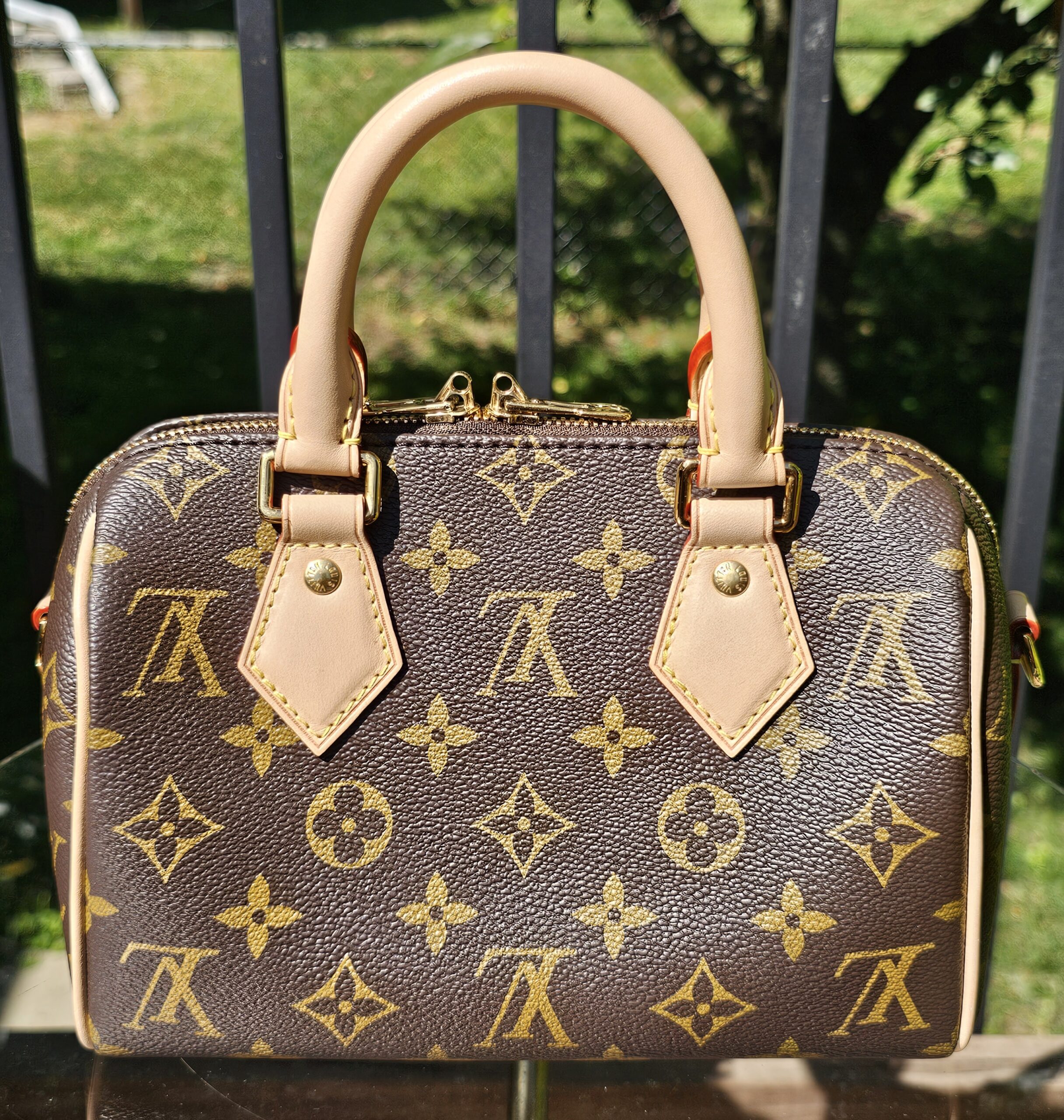 Angled view of the Monogram Speedy Bandouliere 20