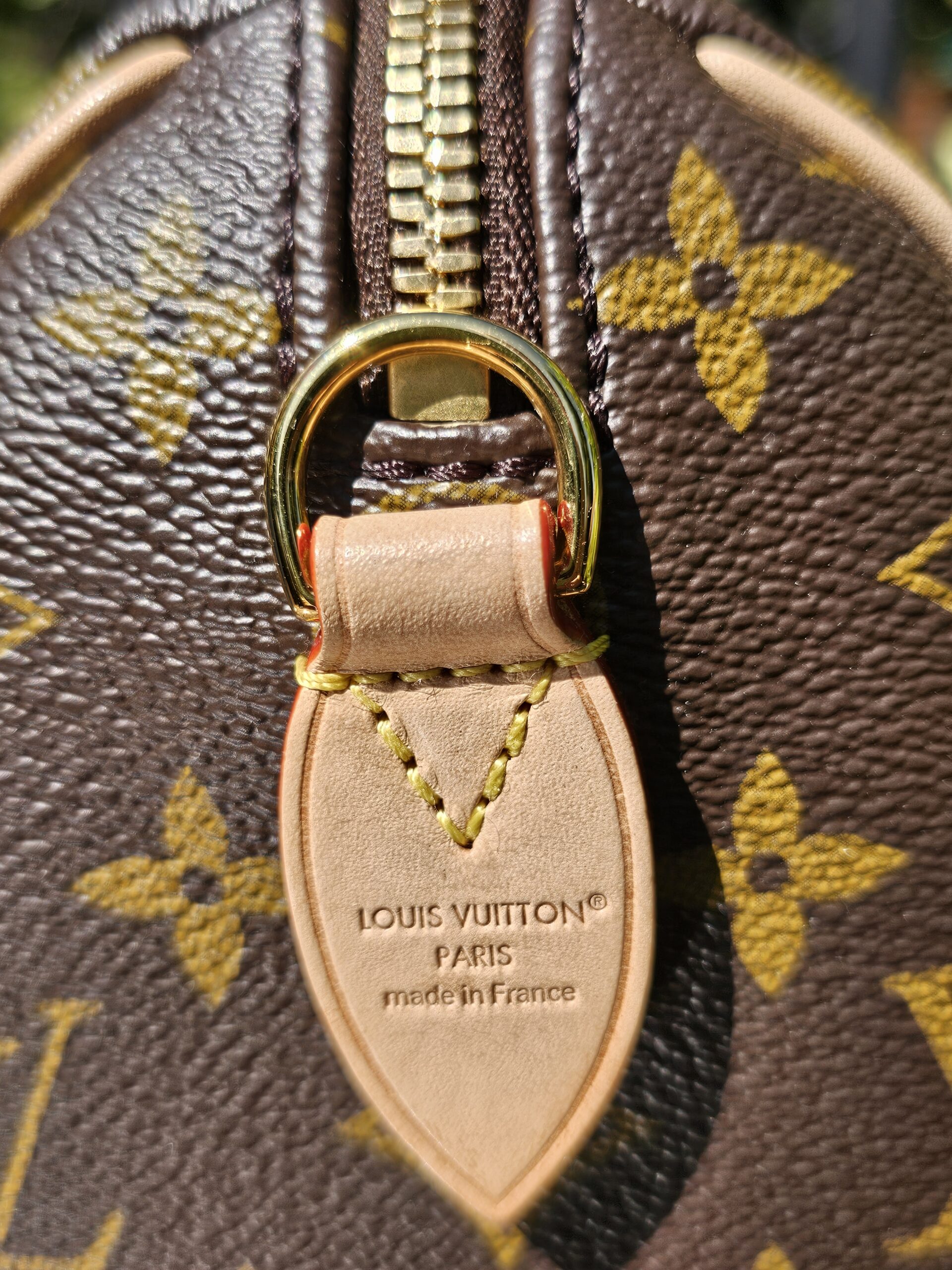 LOUIS VUITTON PARIS made in France heat stamp on the leather tab