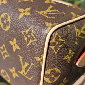 Corner of the Monogram canvas with red trim