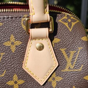Handle tab beside the zip on the Monogram Speedy