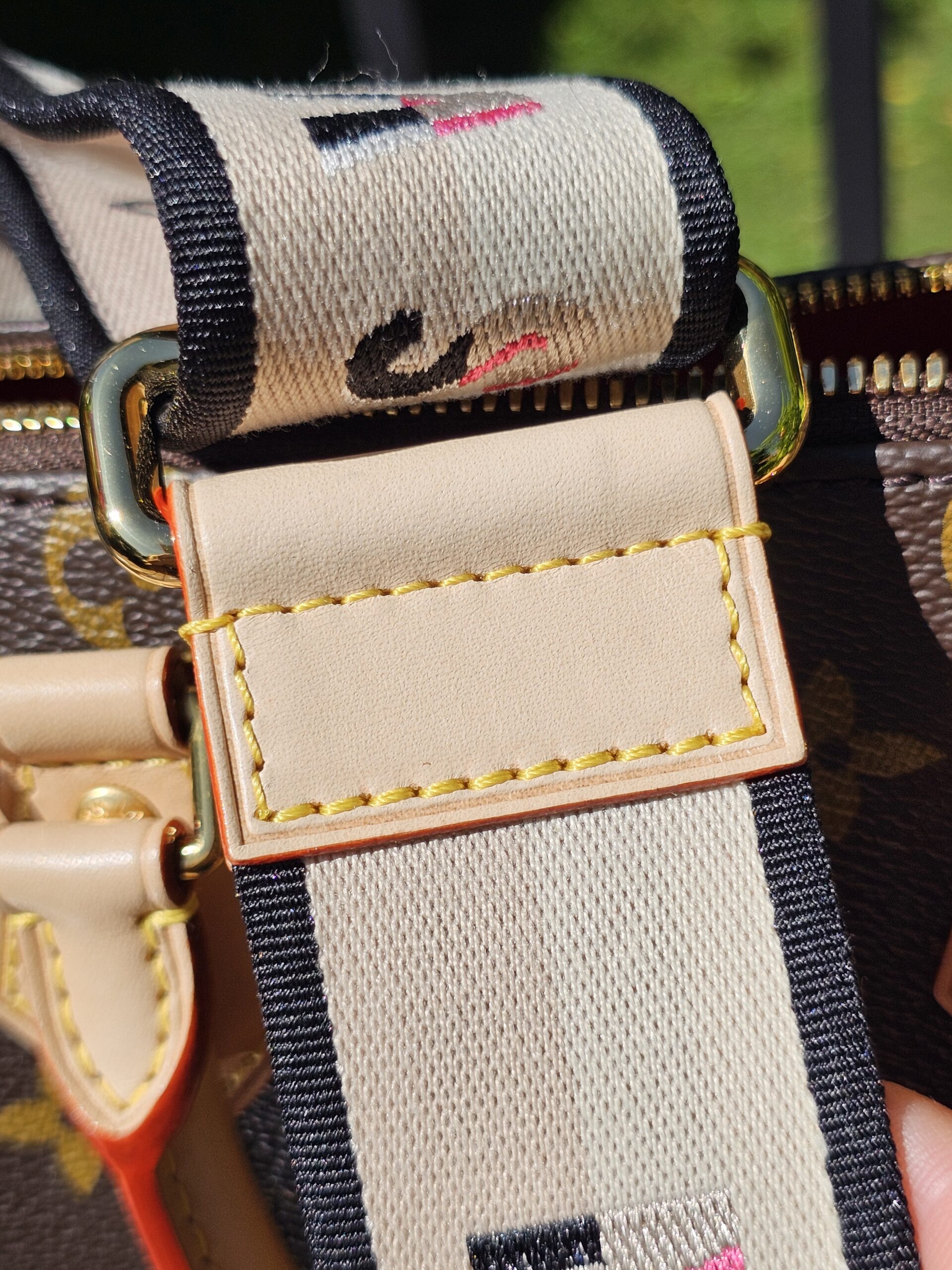 Printed strap folded beside the Monogram canvas