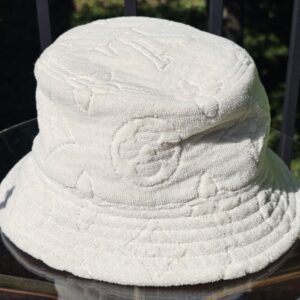 Side view of the cream Monogram jacquard bucket hat
