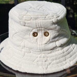 Gold-tone eyelets on the side of the LVacation bucket hat