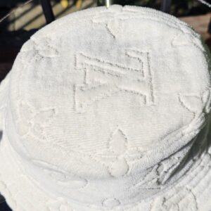 Top of the bucket hat showing the raised LV monogram