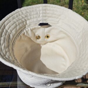 Hat turned to show the smooth cotton reverse side