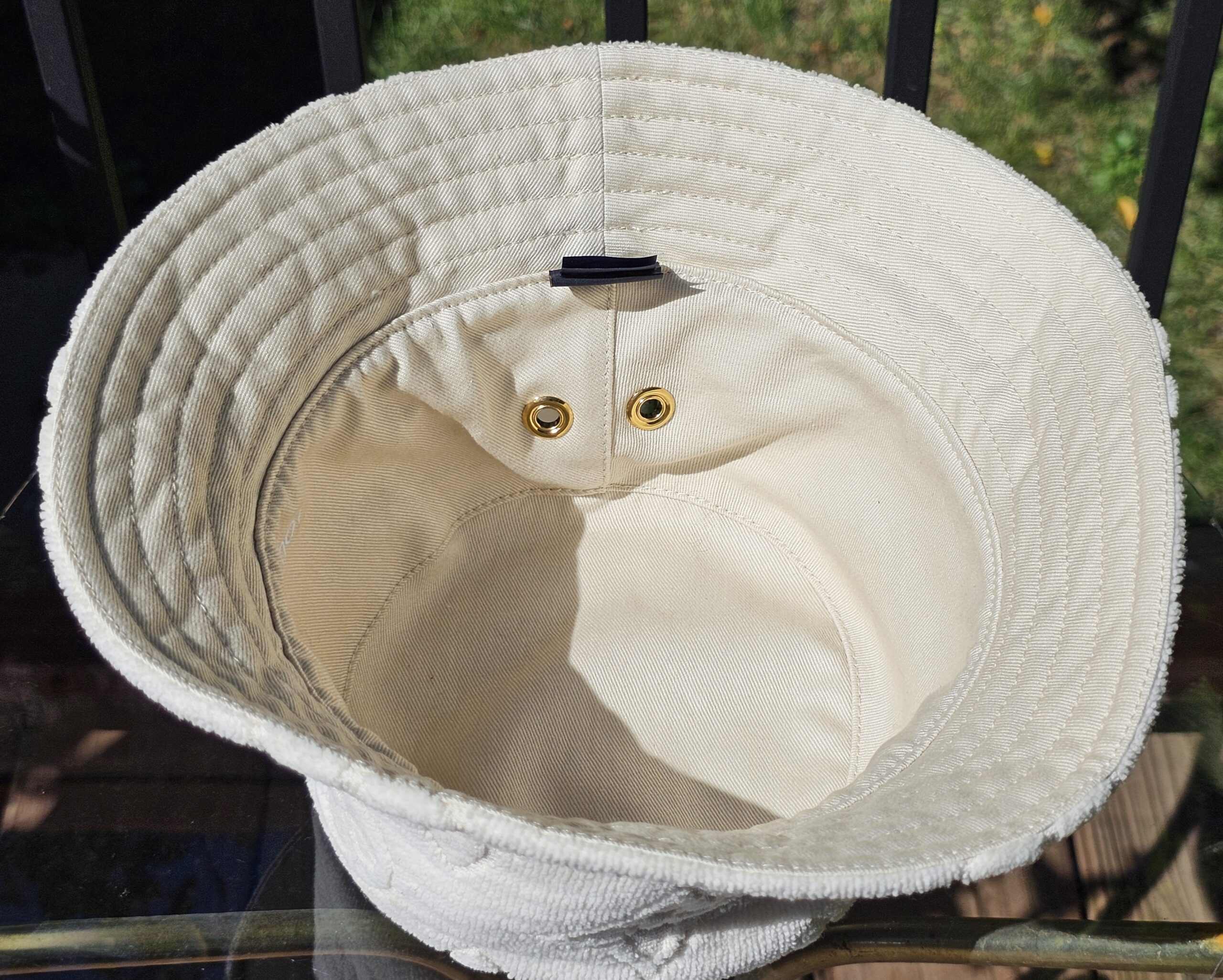 Hat turned to show the smooth cotton reverse side