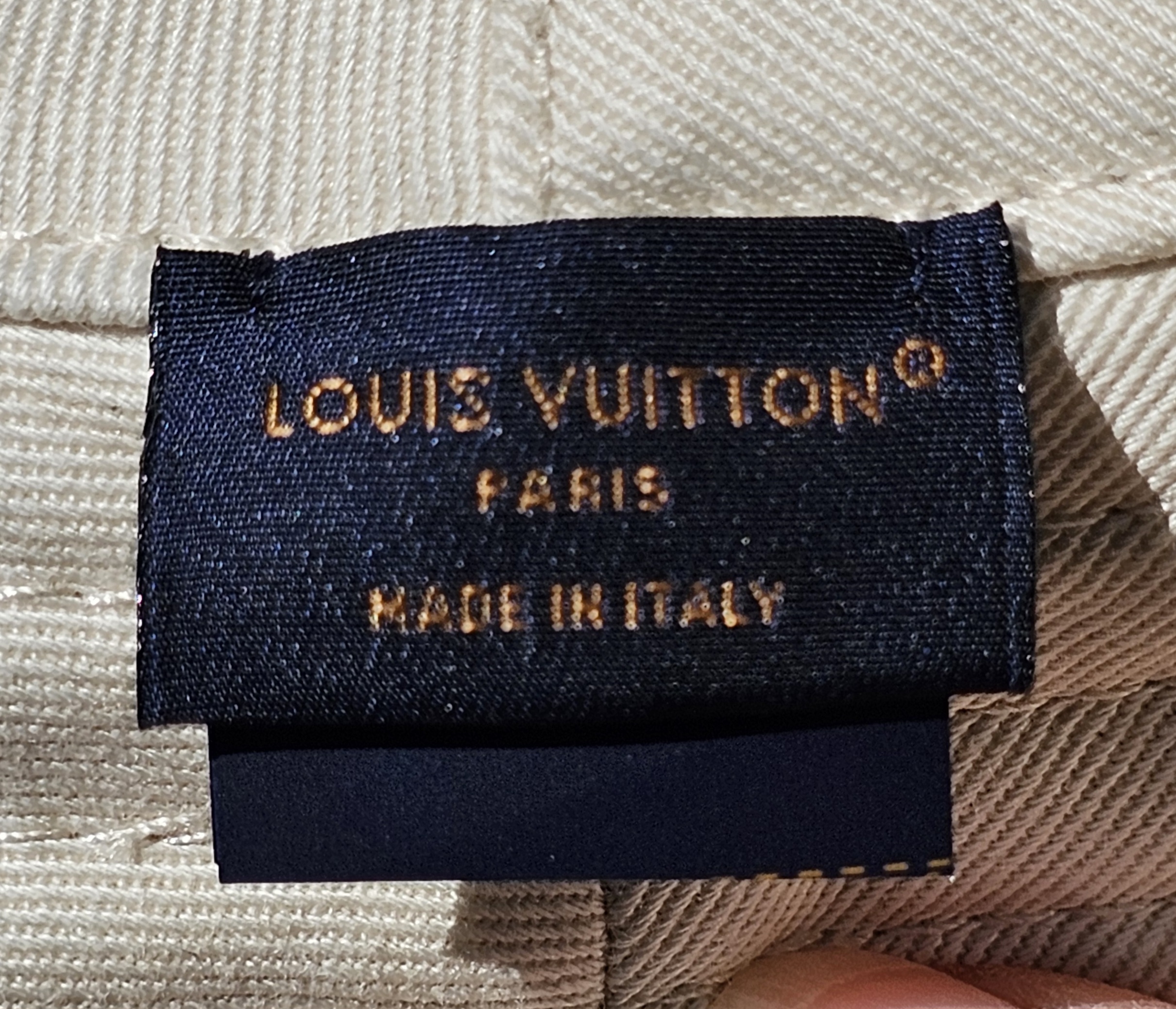 LOUIS VUITTON PARIS made in Italy label inside the bucket hat
