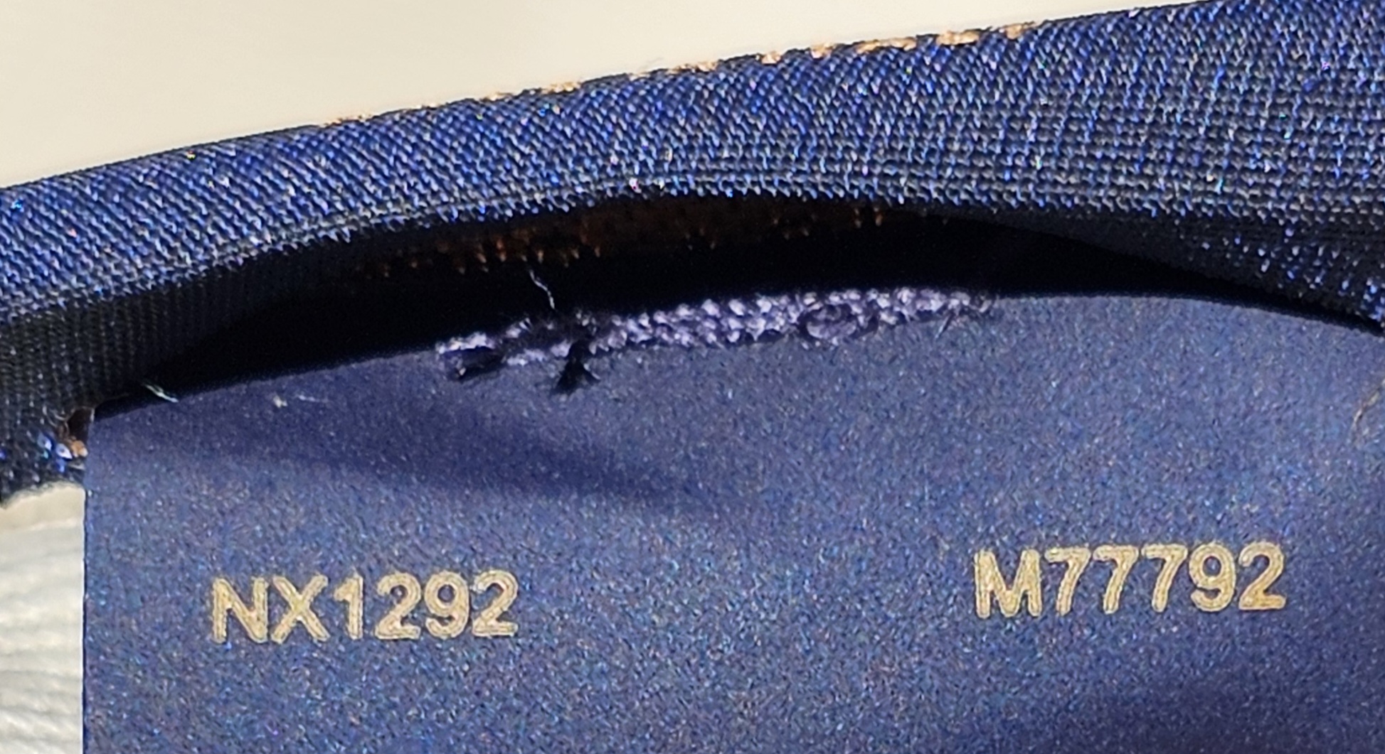 Interior tag showing code NX1292 and reference M77792