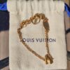 Louis Vuitton LV and Me H Charm Bracelet Gold - the bracelet laid on its Louis Vuitton dust pouch