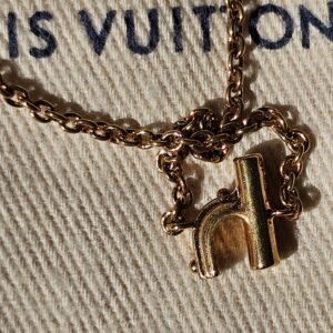 Close-up of the H charm and chain on the LV and Me bracelet