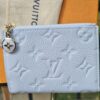 Louis Vuitton Monogram Empreinte Lisa Wallet Blue Olympe - front view with the enamel Monogram flower charm