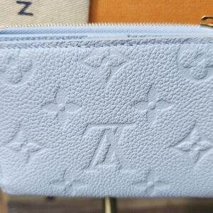Back of the Blue Olympe Lisa Wallet in embossed Monogram Empreinte leather