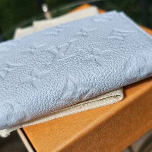 Side profile of the Lisa Wallet showing its slim folded shape
