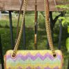 Gucci GG Marmont Multicolor Raffia Flap Shoulder Bag - front view with the aged gold Double G and chain strap