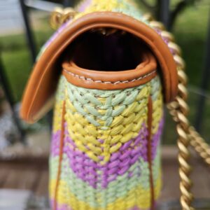Side of the multicolor raffia Marmont showing the chevron weave