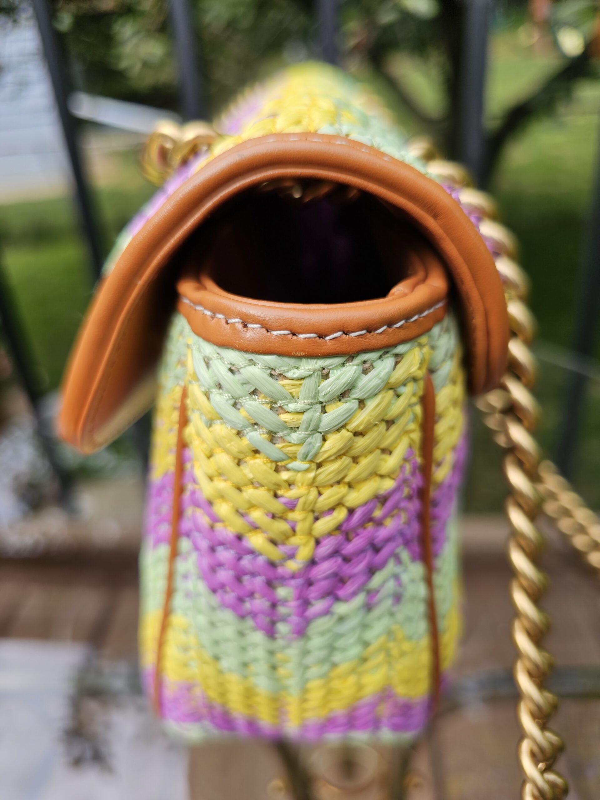 Side of the multicolor raffia Marmont showing the chevron weave