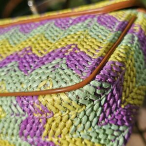 Close-up of the mint, yellow and purple chevron raffia weave