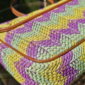 Side panel and leather trim of the GG Marmont raffia bag