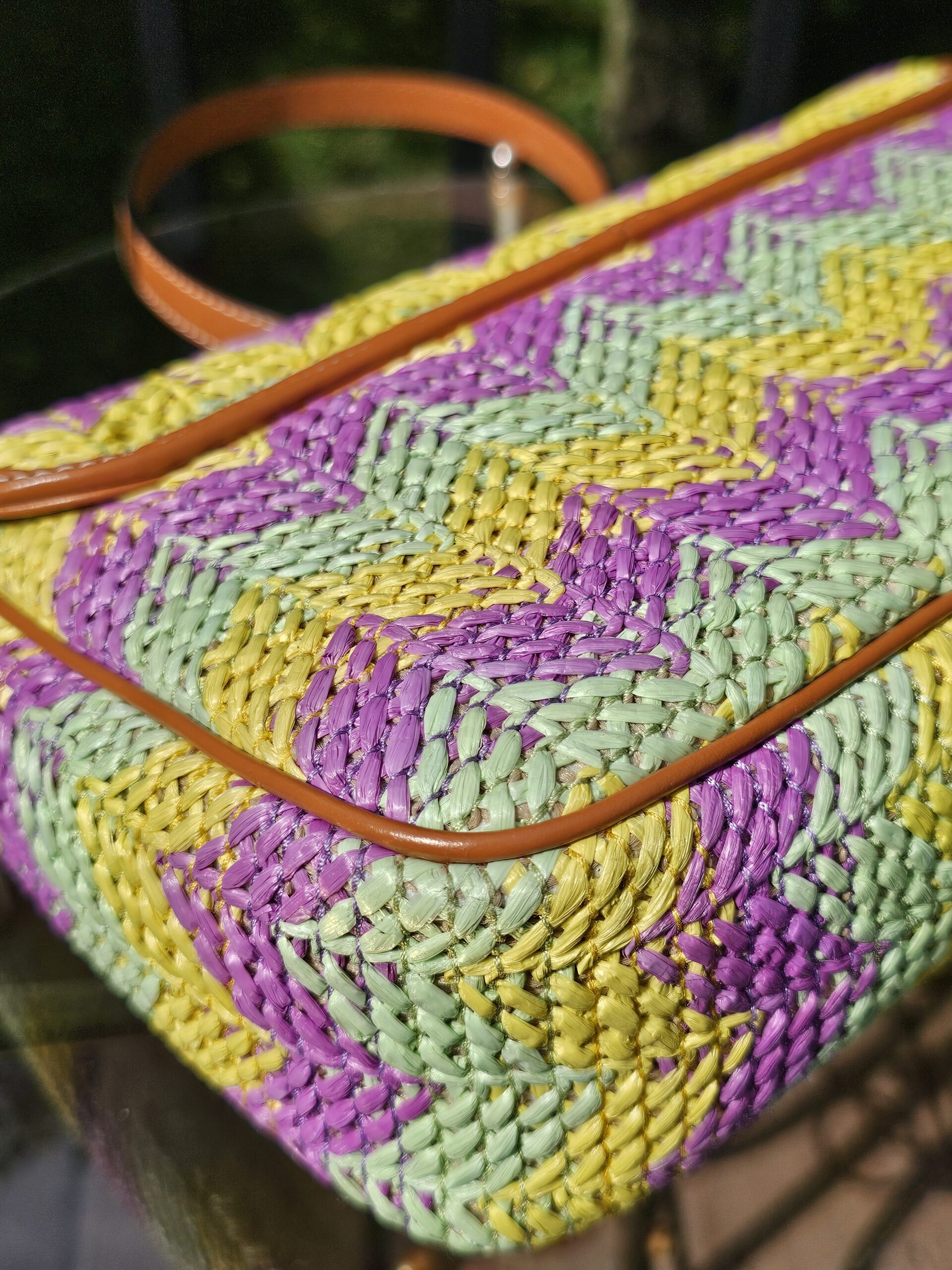 Side panel and leather trim of the GG Marmont raffia bag