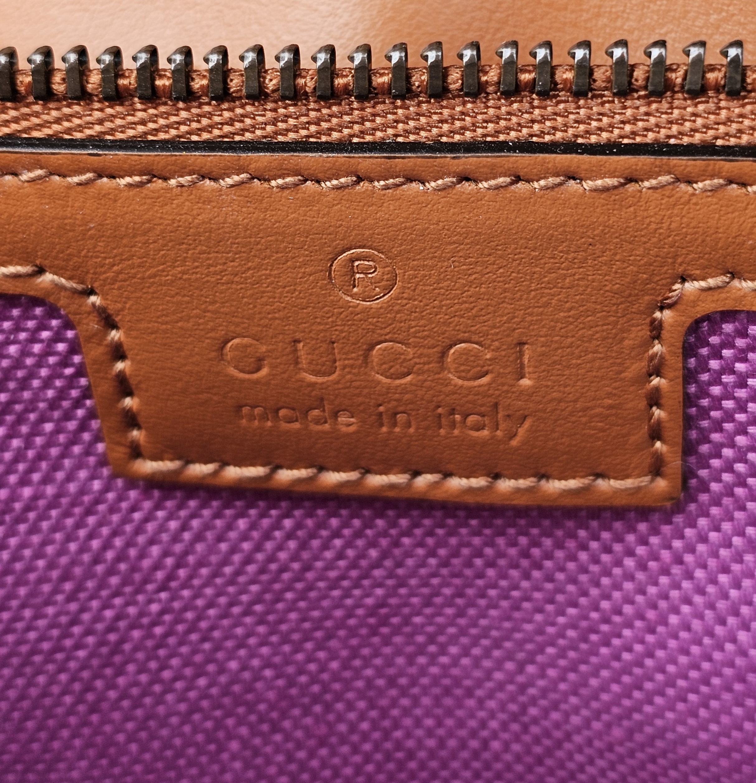 GUCCI made in Italy stamp on the tan leather interior patch