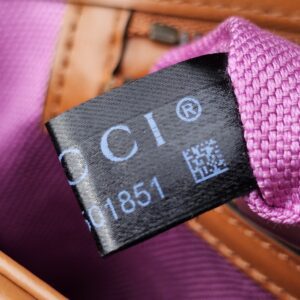 Gucci care tag inside the raffia Marmont