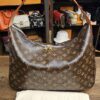 Louis Vuitton Monogram Slouchy MM - front of the hobo with its Louis Vuitton dust bag
