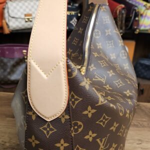 Side profile of the Slouchy MM showing the wide vachetta strap