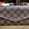 Louis Vuitton Damier Ebene Sarah Wallet - front of the wallet with the snap flap closed
