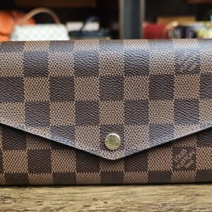 Louis Vuitton Damier Ebene Sarah Wallet - front of the wallet with the snap flap closed