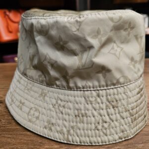 Sage Monogram side of the reversible bucket hat from another angle