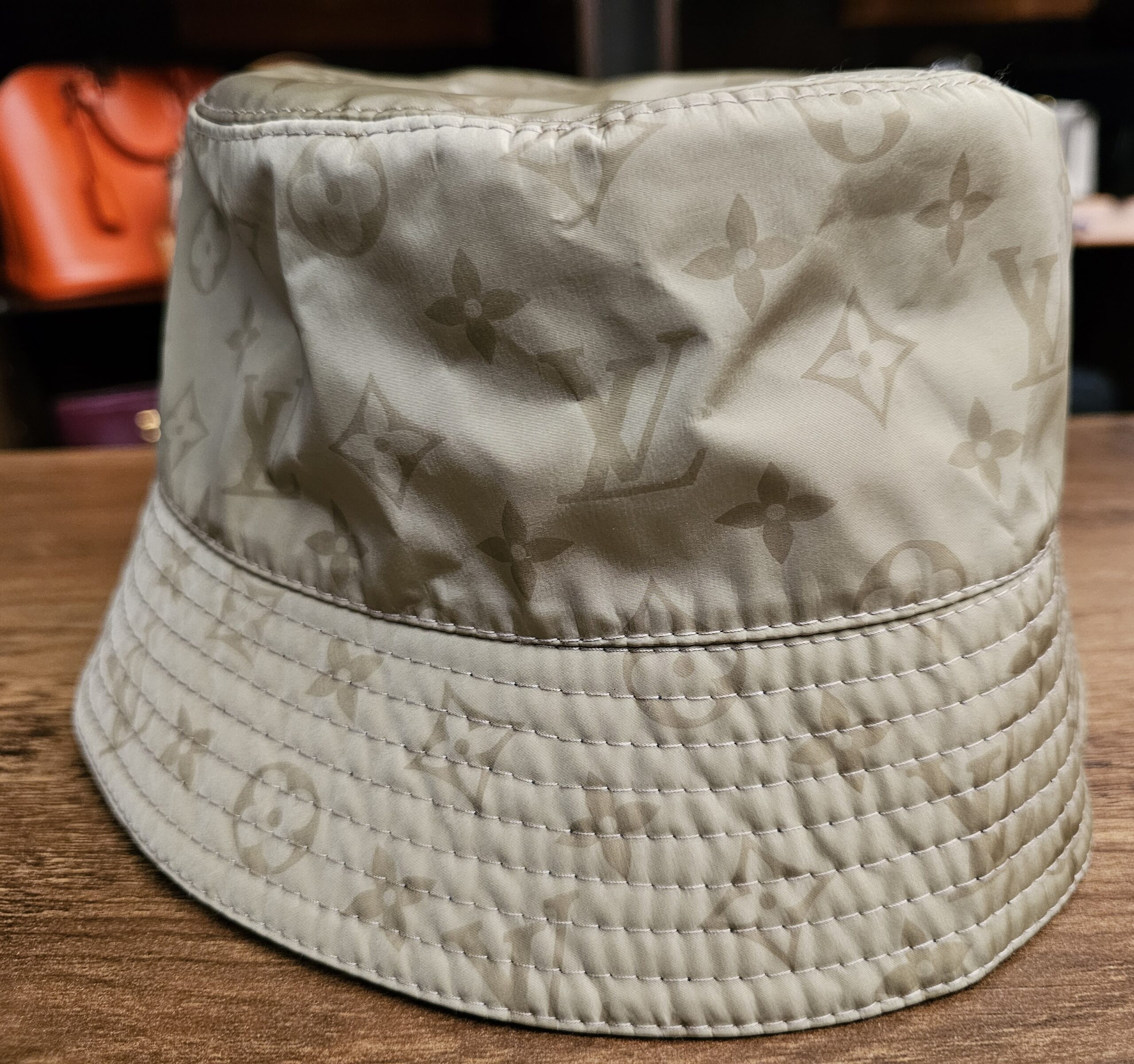 Sage Monogram side of the reversible bucket hat from another angle
