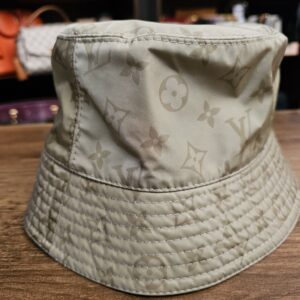 Sage side of the bucket hat showing the stitched brim