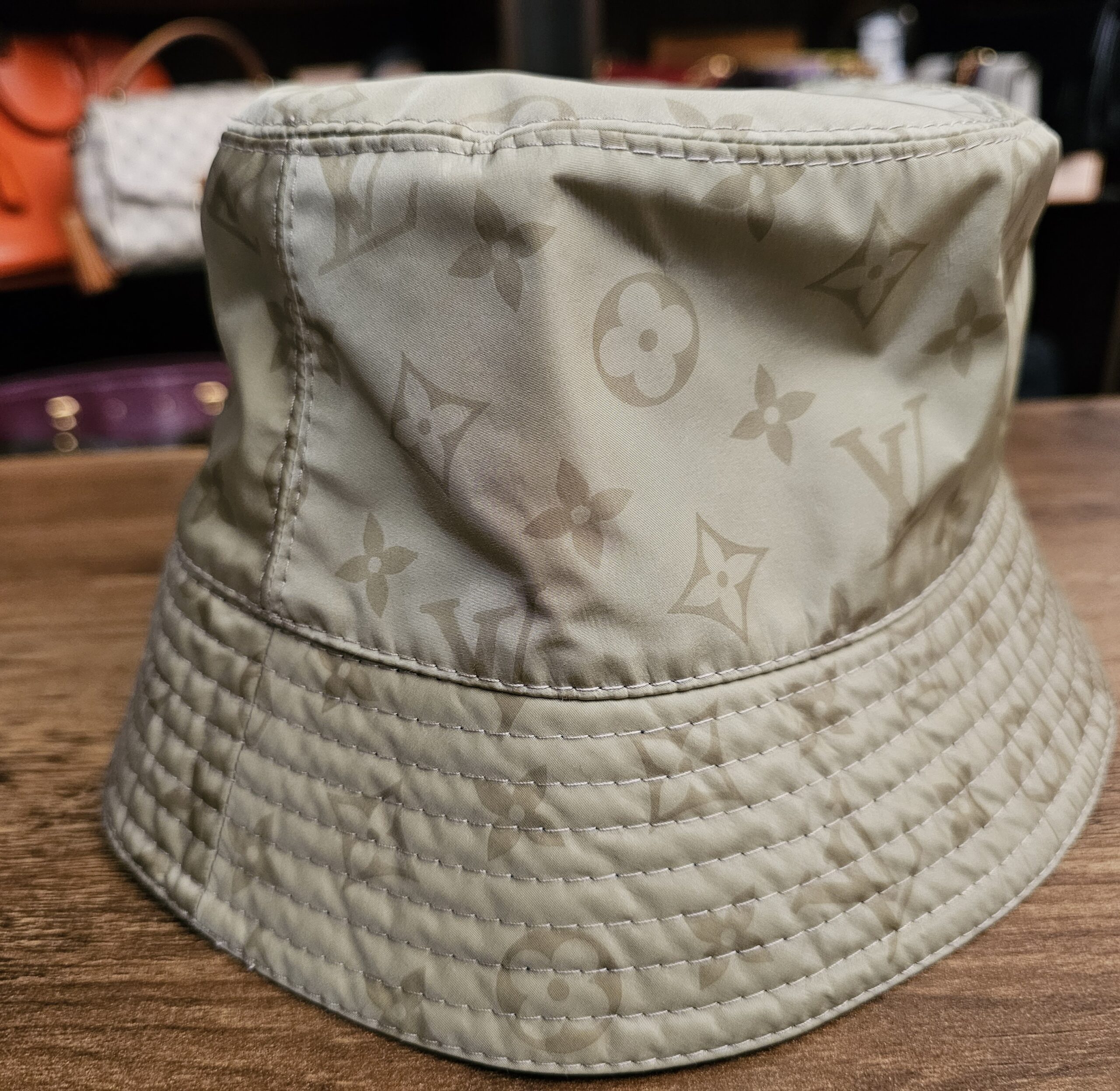 Sage side of the bucket hat showing the stitched brim
