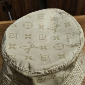 Close-up of the Monogram print on the crown of the hat