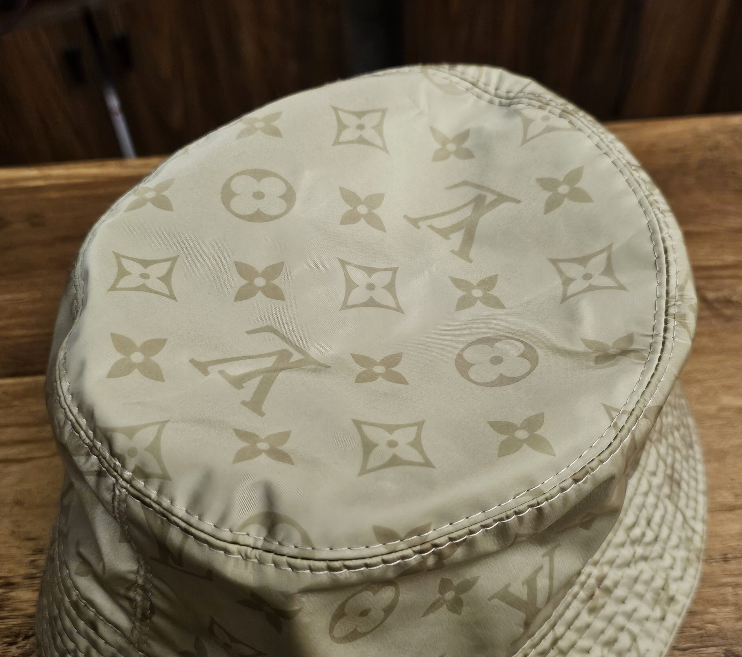 Close-up of the Monogram print on the crown of the hat