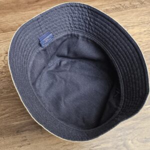 Hat turned over to show the graphite side as the lining