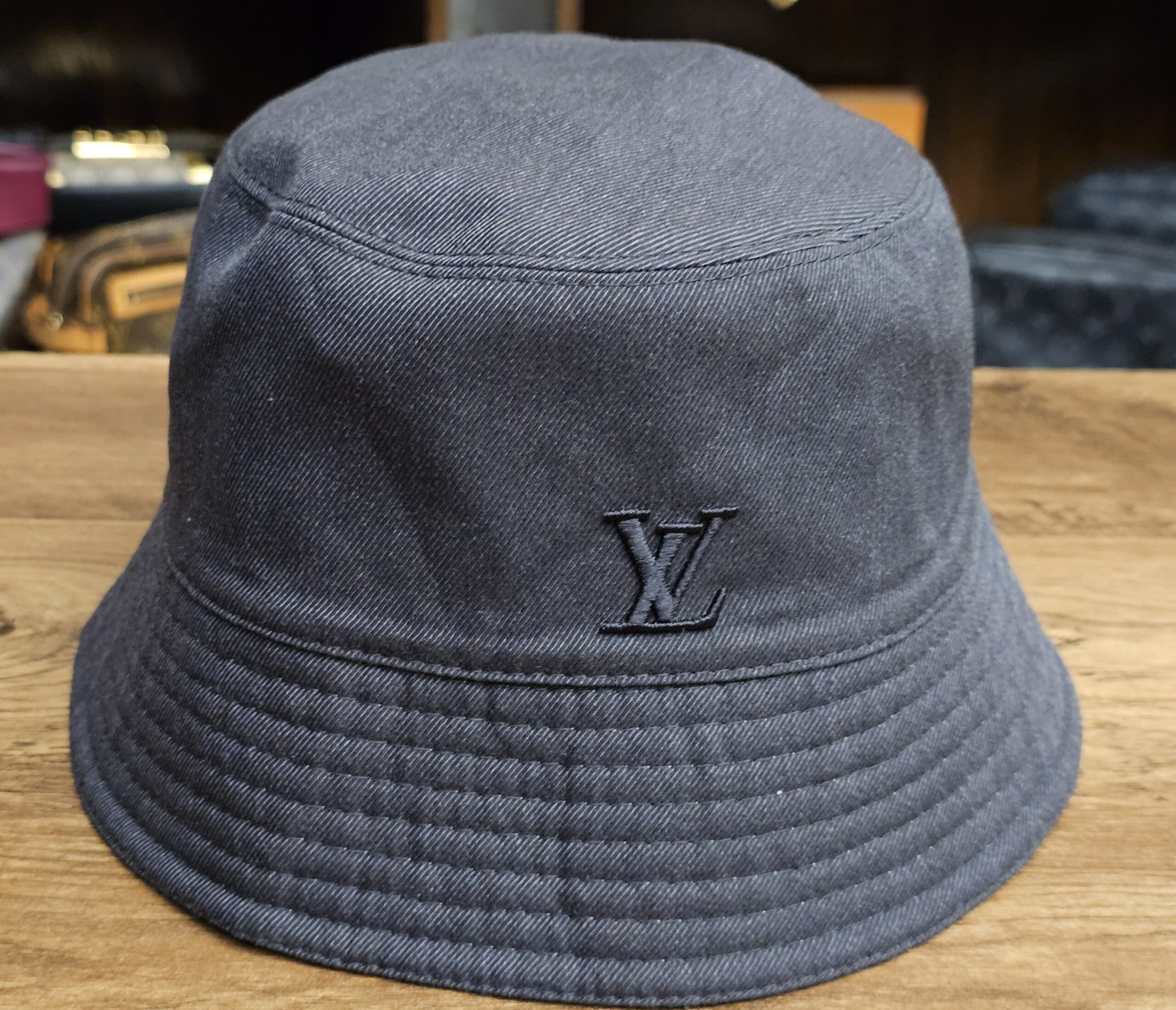 Graphite side of the bucket hat with the embroidered LV