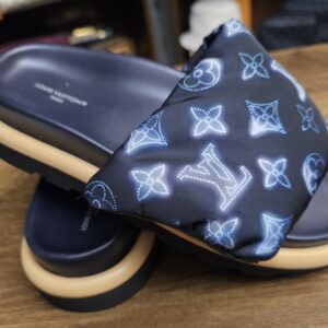 Opposite side of the navy Monogram nylon mules