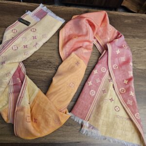 Stole loosely draped showing the pink, orange and cream color blocks