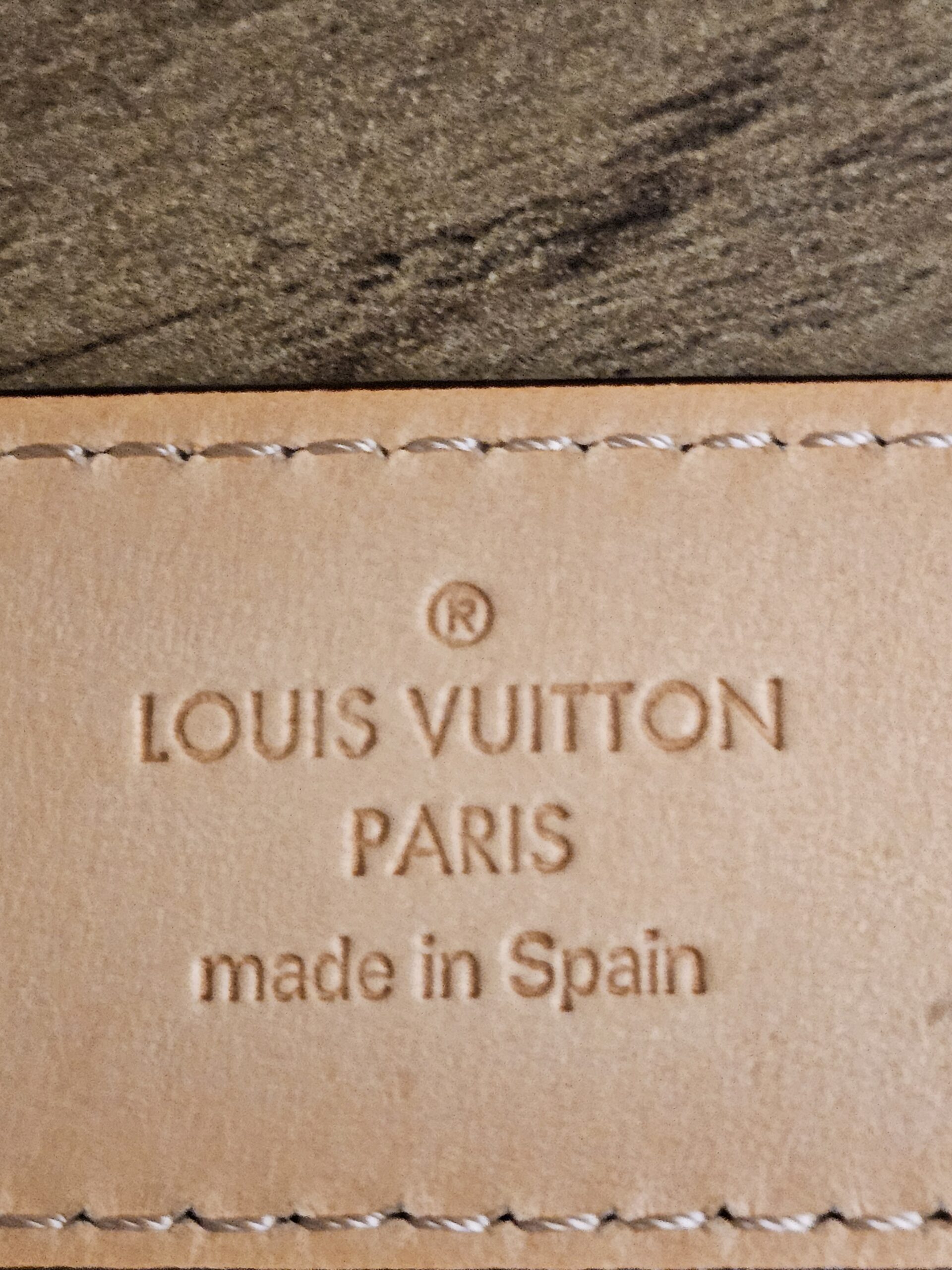 LOUIS VUITTON PARIS made in Spain stamp on the belt underside
