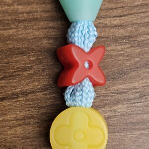 Teal, red and yellow resin beads on the braided cord