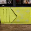 Louis Vuitton Taïgarama Coin Card Holder Yellow - front showing the card slots and V-shaped pocket in yellow Taïga leather and Monogram